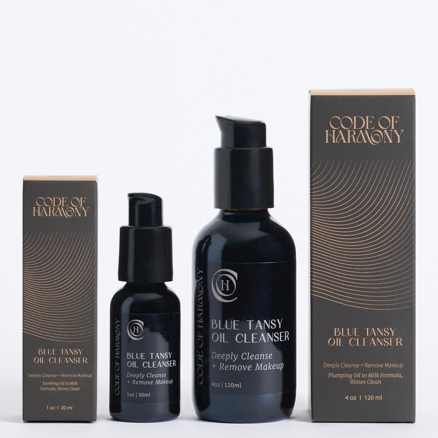 Code of Harmony Blue Tansy Oil Cleanser 1 oz and 4 oz bottles with product boxes