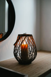 Busy Bees 3 Inch by 6 Inch pillar candle burning outdoors in soft evening light with a blurred natural background.