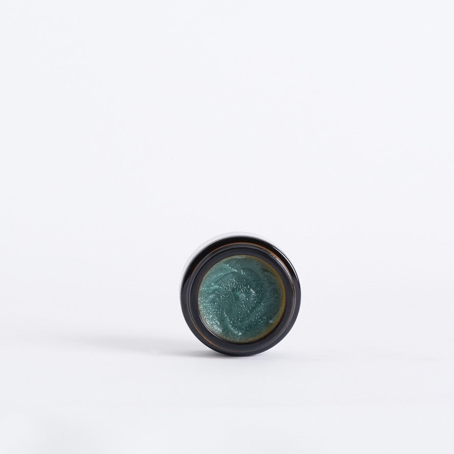 Open jar showing the teal balm texture of Code of Harmony Ceru Blue Barrier Balm