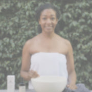 Woman using Annmarie Aloe Herb Cleanser as part of a daily skincare routine