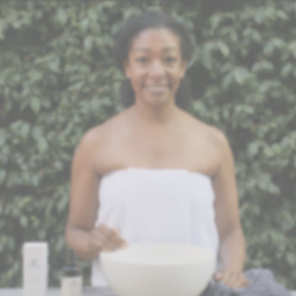Woman using Annmarie Aloe Herb Cleanser as part of a daily skincare routine
