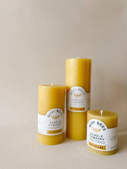 Busy Bees 3 Inch Pillar Trio featuring three natural yellow beeswax pillar candles arranged together against a soft neutral background.