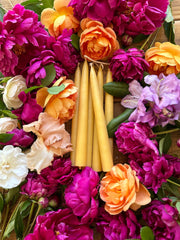 Busy Bees Hand Dipped 9 Inch Taper Candles arranged in a colorful floral centerpiece.