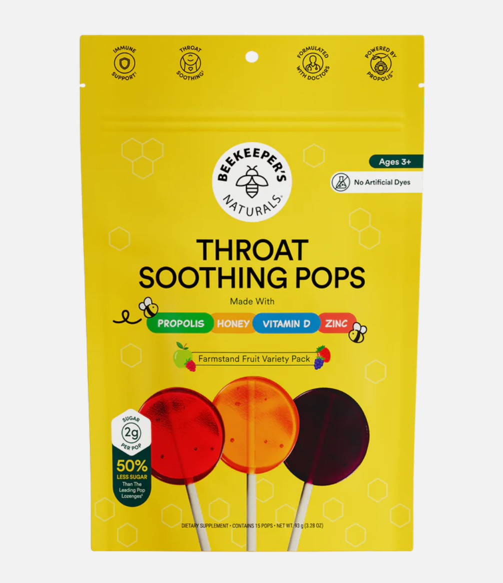Yellow package of Beekeeper's Naturals Throat Soothing Pops with colorful lollipops on a white background