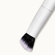 Precision tapered end of Mama Sol Buff & Blur complexion brush for targeted application