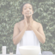 Woman using Citrus Mint Cleanser as part of a daily skincare routine
