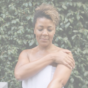 Woman applying Annmarie Coconut Body Oil for hydrated and silky smooth skin