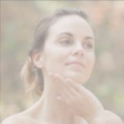 Woman enjoying a skincare routine with Annmarie Coconut Honey Mask for hydrated, glowing skin