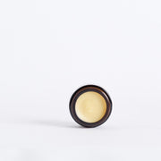 Open jar showing the rich balm texture of Code of Harmony Copious Barrier Balm