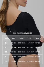 Side profile of a woman in the Elastique Athletics Iconic black bodysuit with Size Guide overlay displayed across the image.