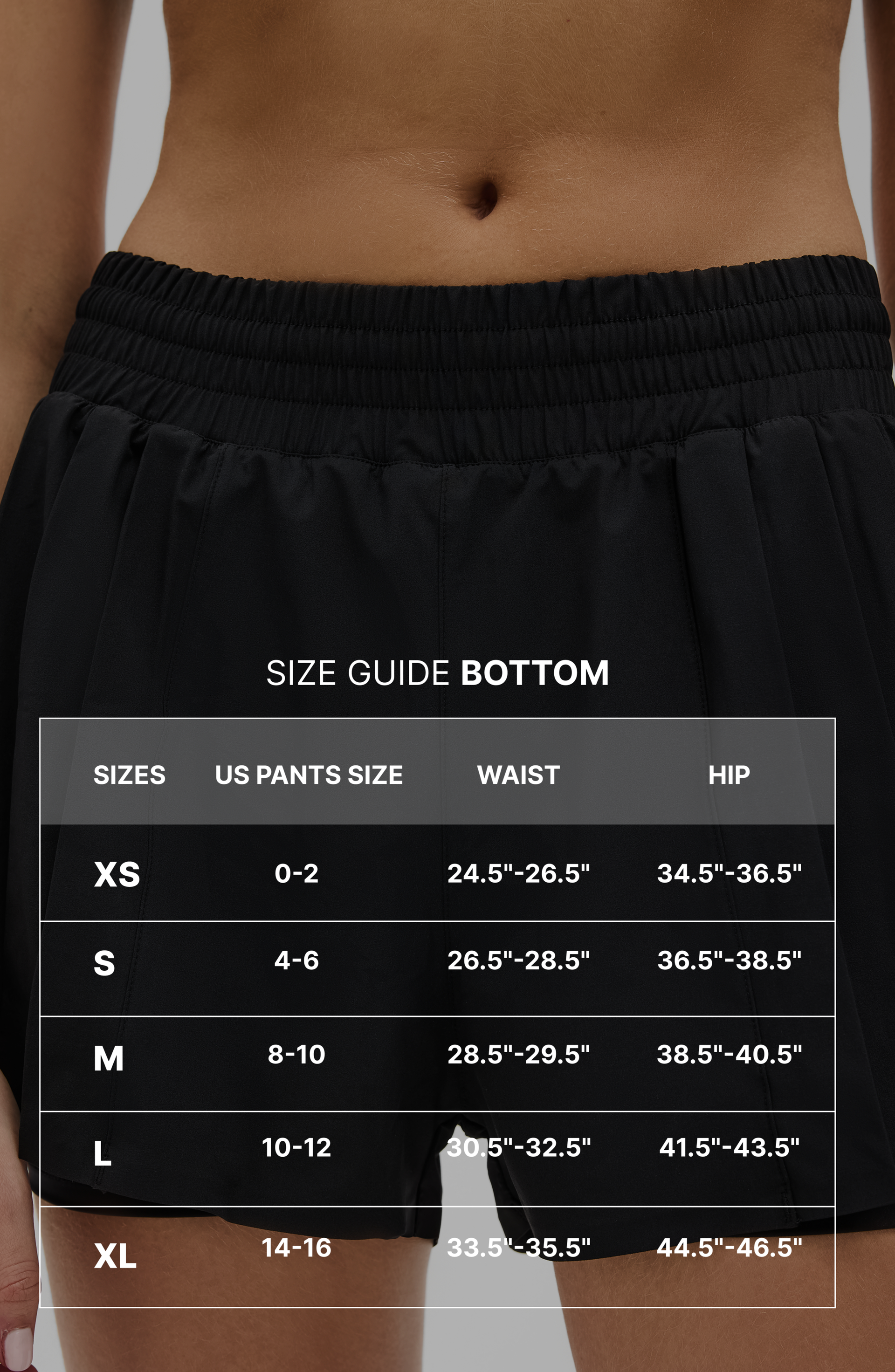 Size guide graphic for the Elastique Athletics L'Original Flowy Short with measurement overlay text across a close up image of the black shorts.