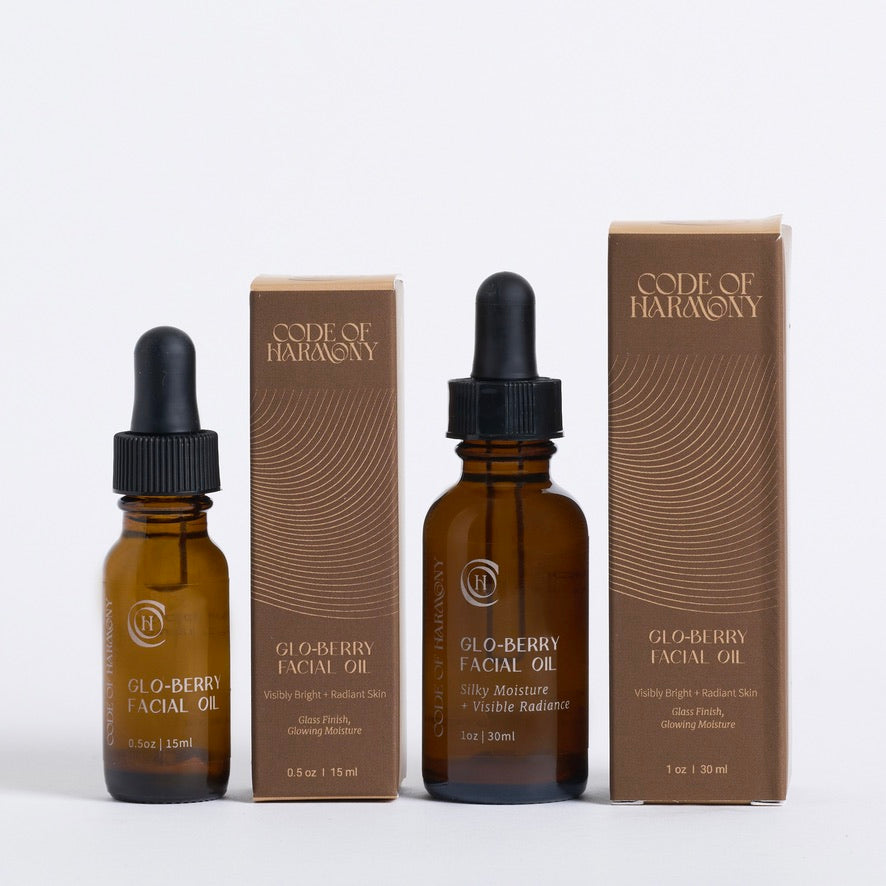Code of Harmony Glo-Berry Facial Oil 0.5 oz and 1 oz bottles with product boxes