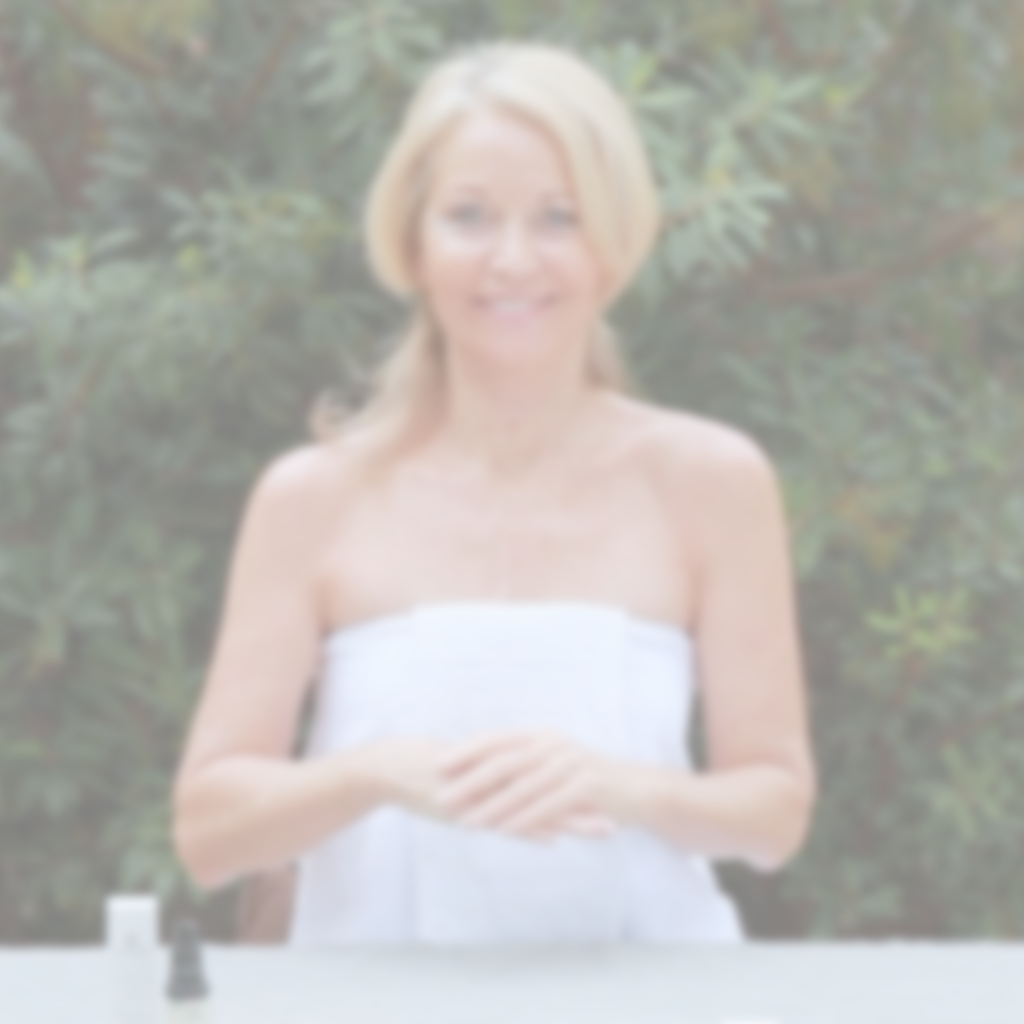 Woman incorporating Annmarie Herbal Facial Oil into a daily skincare routine