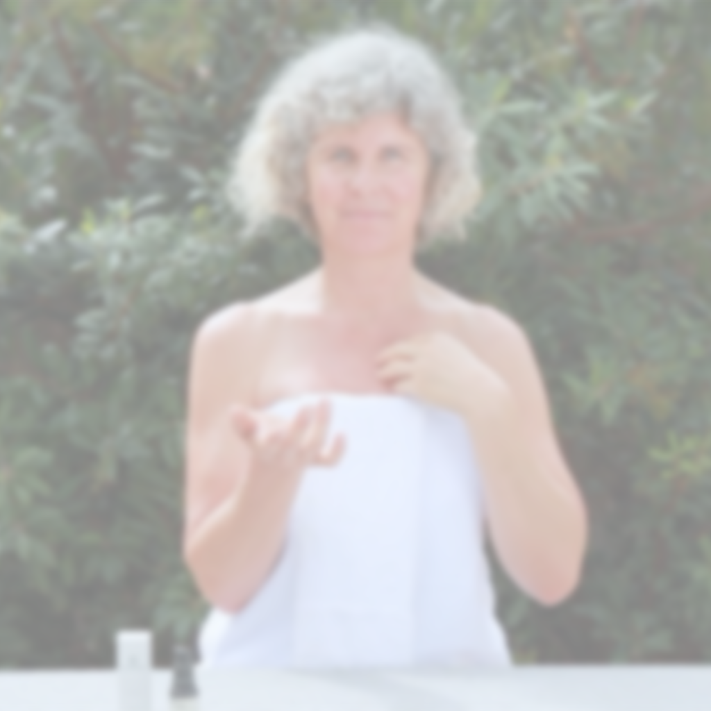 Person using Annmarie Herbal Facial Oil for Sensitive Skin as part of a gentle skincare routine