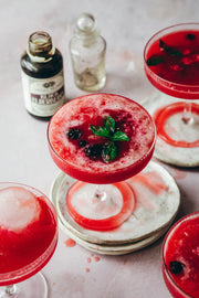 Anima mundi black elderberry elixir in a wine glass