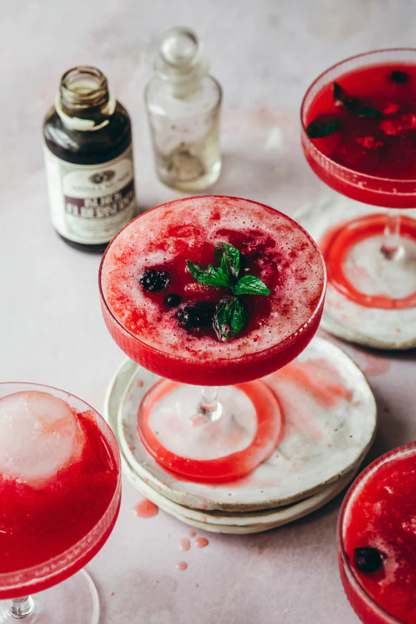 Anima mundi black elderberry elixir in a wine glass