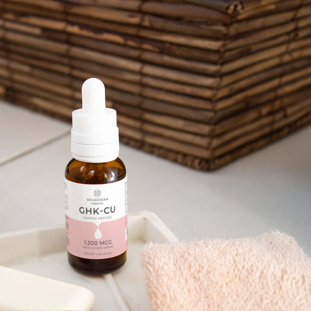 Lifestyle image of Neurogan Health GHK-Cu Neck and Face Serum on a bathroom counter.