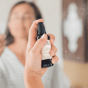 Woman applying Annmarie Neroli Toning Mist facial spray during a natural skincare routine