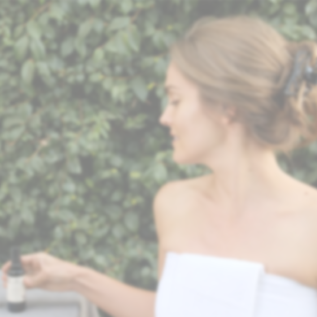 Woman using Annmarie Neroli Toning Mist outdoors for refreshed and hydrated skin