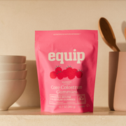 Equip Core Colostrum Gummies in Raspberry, pink 12.7 oz pouch of grass-fed bovine colostrum gummies