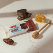 Equip Prime Bar chocolate flavor with wrapped and unwrapped bars and chocolate pieces