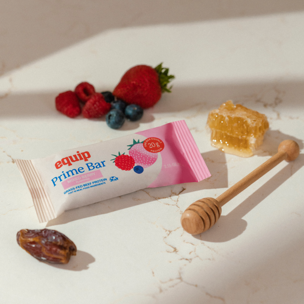 Equip Prime Bar mixed berry flavor with wrapped and unwrapped bars and fresh berries