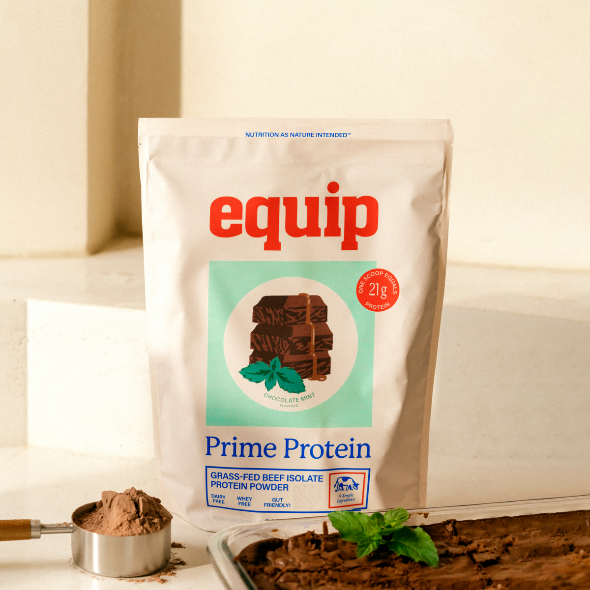 Equip Prime Protein chocolate mint bag with mint leaves, chocolate pieces, and a protein drink
