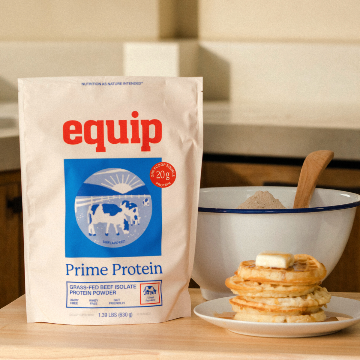 Equip Prime Protein unflavored bag with a creamy protein drink on a kitchen counter