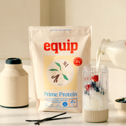 Equip Prime Protein vanilla bag with vanilla flowers and a creamy protein drink