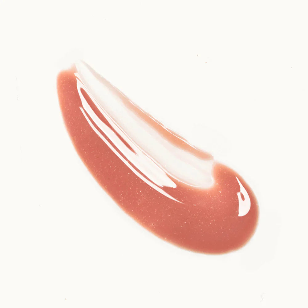 Swatch of sheer nude Mama Sol LIPBRELLA™ tinted lip oil