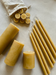 Busy Bees The Queen Bee Bundle featuring beeswax pillar candles, taper candles, and tea lights arranged together on a soft neutral surface.