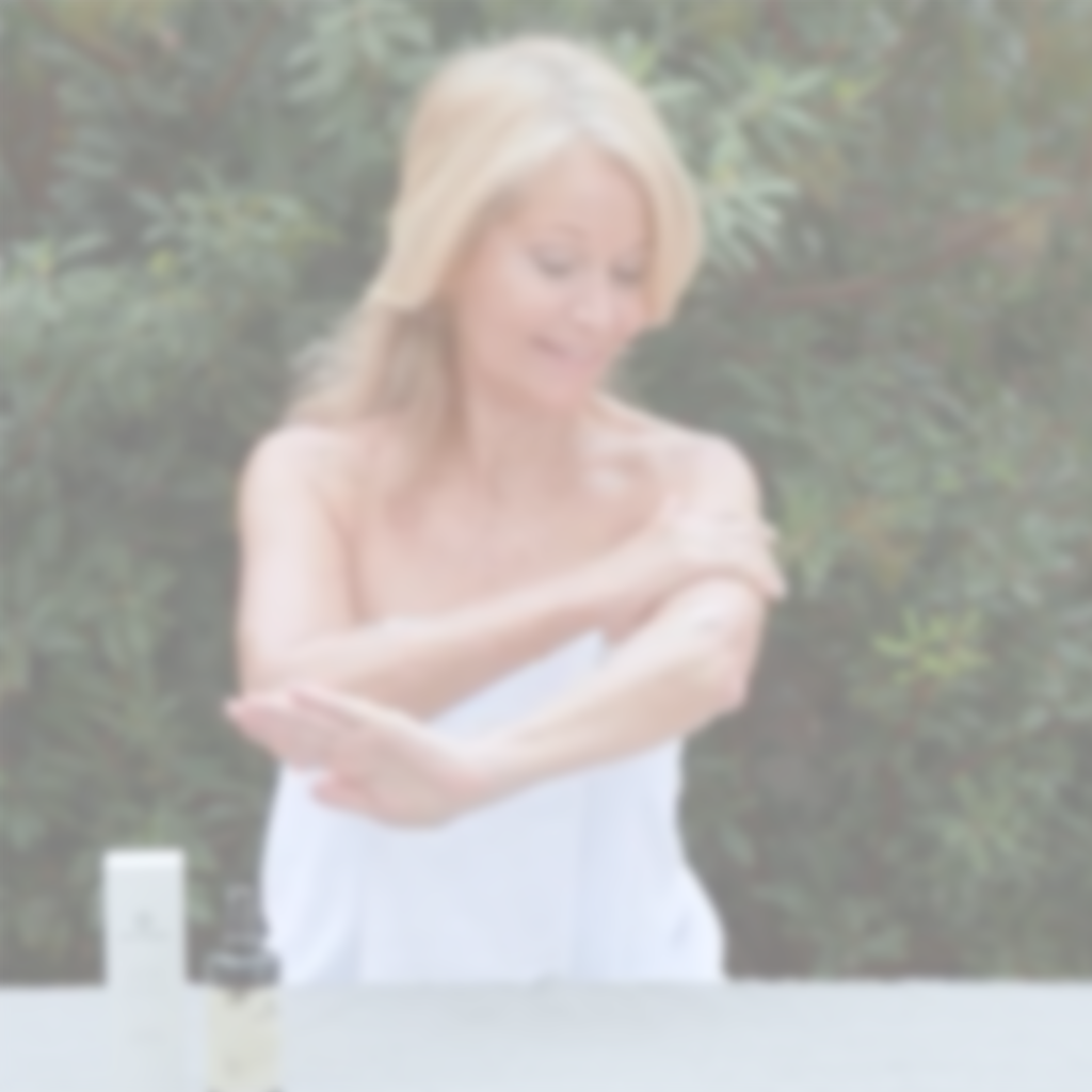 Woman applying Annmarie Radiant Skin Silk Body Lotion as part of a daily skincare routine