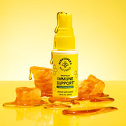 Propolis Immune Support Throat Spray with natural honey background.