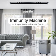 Austin Air Immunity Machine graphite air purifier in a modern living room