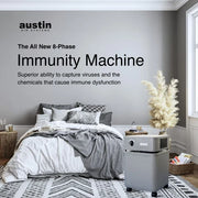 Austin Air Immunity Machine air purifier in a bedroom featuring advanced 8-phase air filtration