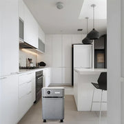 Austin Air Immunity Machine air purifier in a modern white kitchen helping support cleaner indoor air
