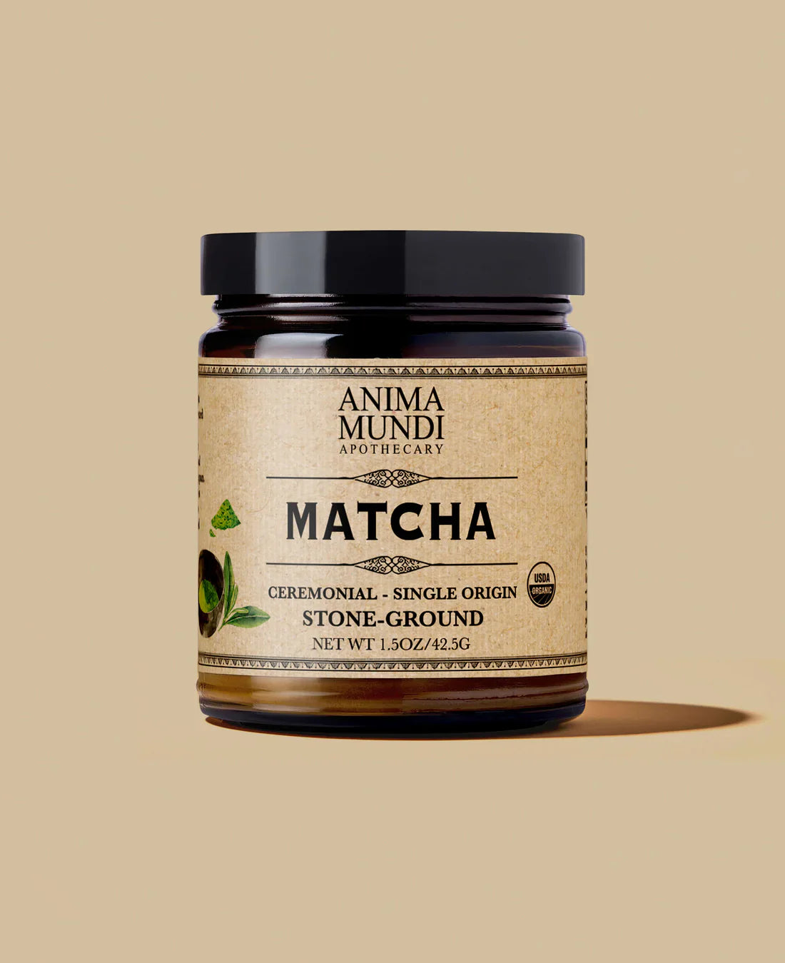 Anima Mundi Matcha ceremonial grade stone-ground organic matcha in an amber glass jar against a neutral background.