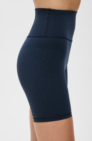 Close up side detail of the Elastique Athletics L'Original Lymphatic Bike Short in navy blue showing the sculpted fit and seamless waistband.