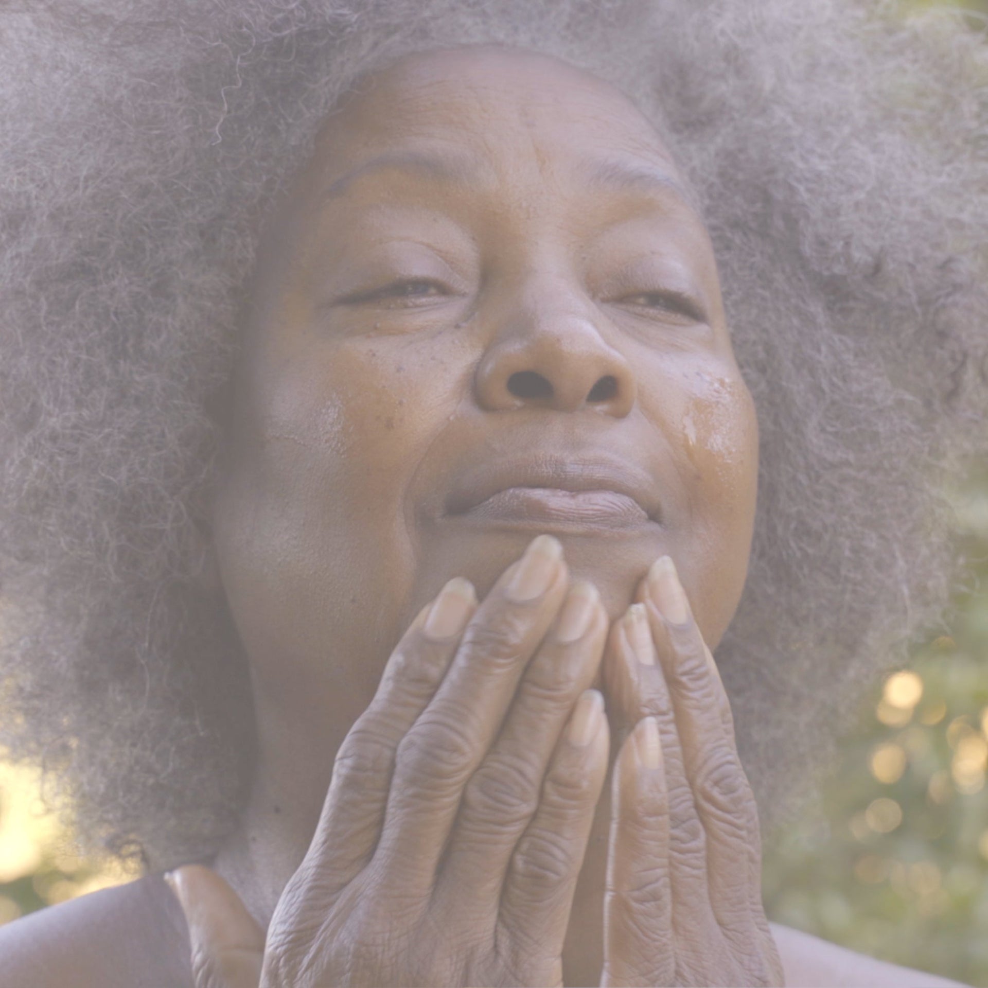 Woman enjoying a radiant skincare ritual with hydrating facial products