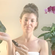 Woman applying Annmarie Oud Révélé natural perfume as part of a daily beauty ritual