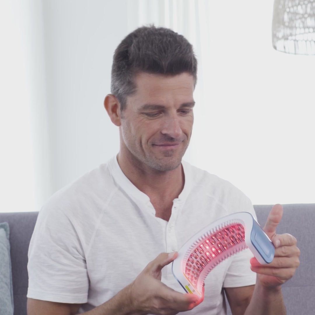 Hairmax LaserBand 82 ComfortFlex being used by a man