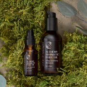 Code of Harmony Alchemy Aromatic Body Oil displayed on green grass