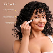 Woman applying complexion product with Mama Sol Buff & Blur makeup brush