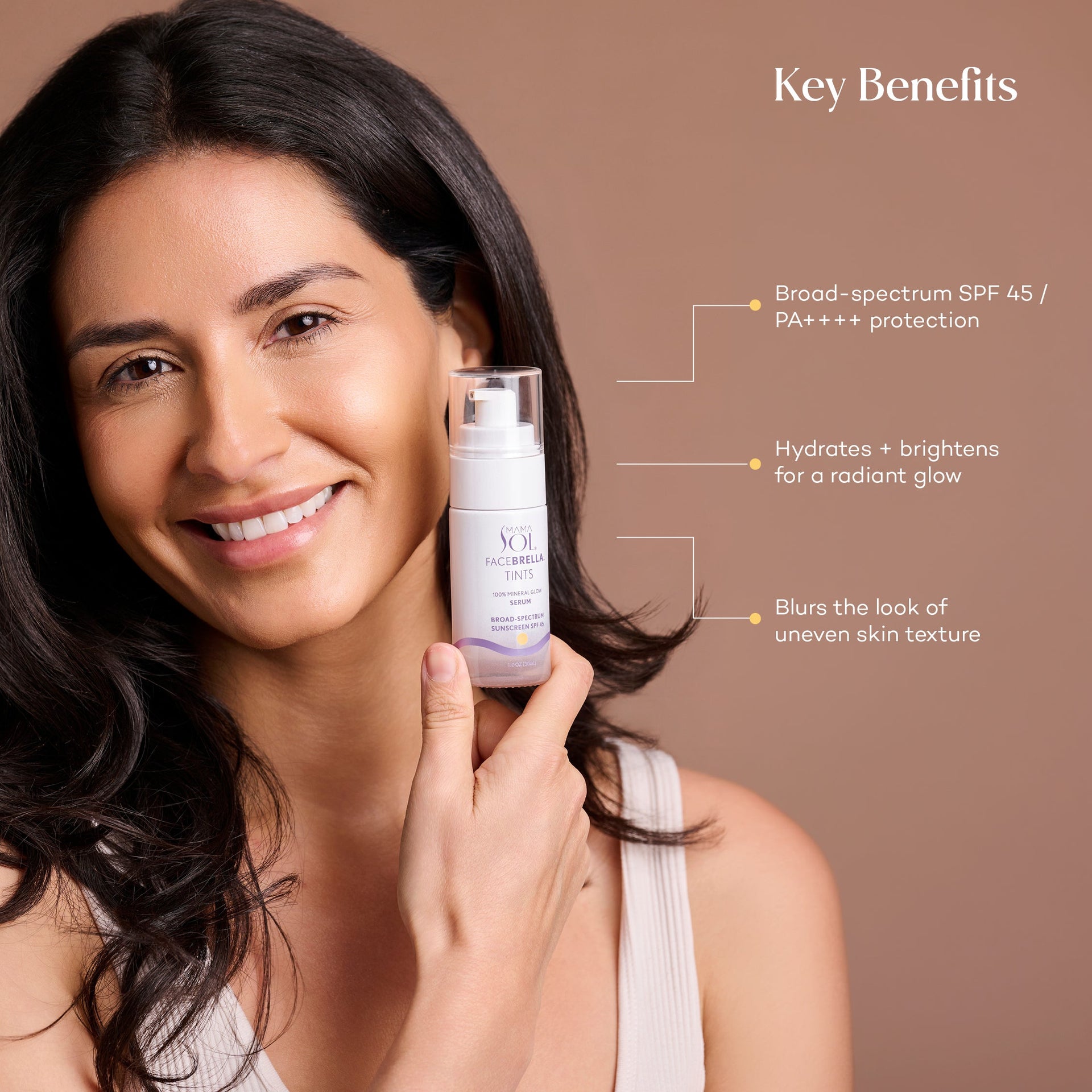 Woman holding Mama Sol FACEBRELLA™ Tints mineral glow serum SPF 45