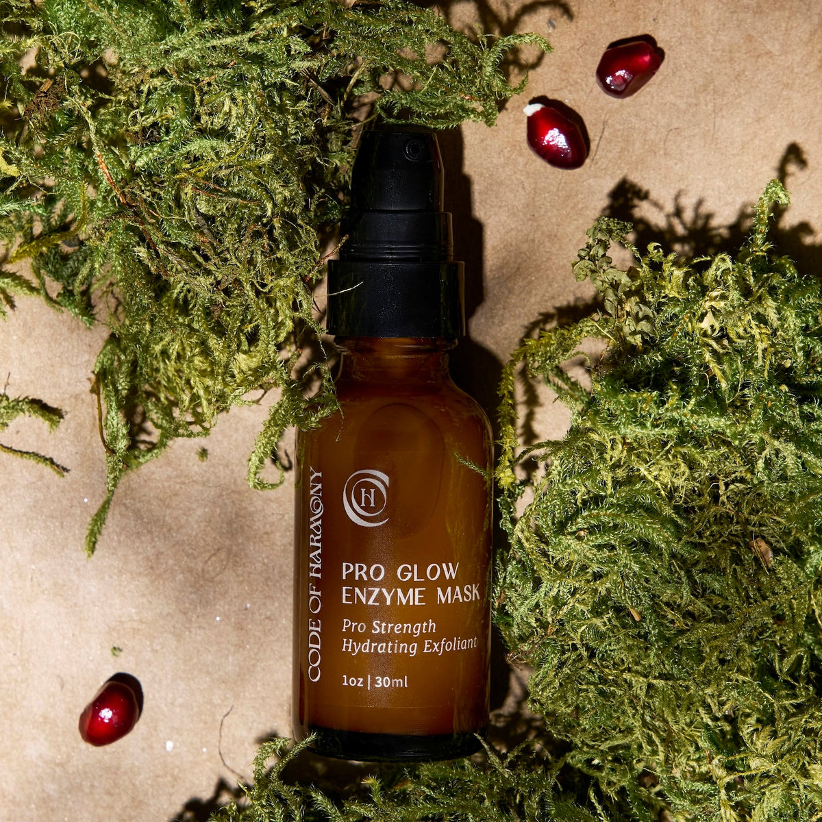 Code of Harmony Pro Glow Enzyme Mask displayed on green grass